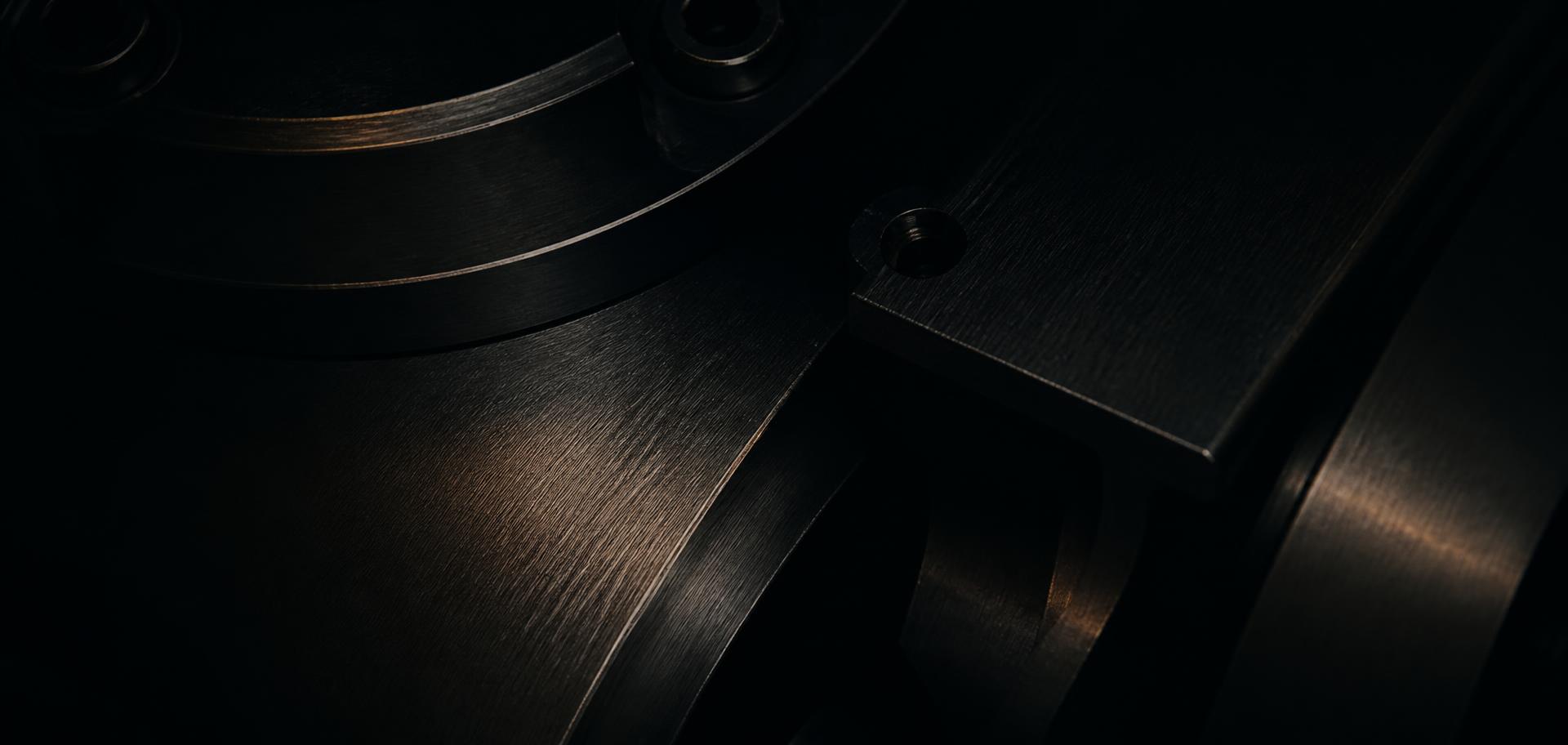 Close detail of brushed steel industrial machinery